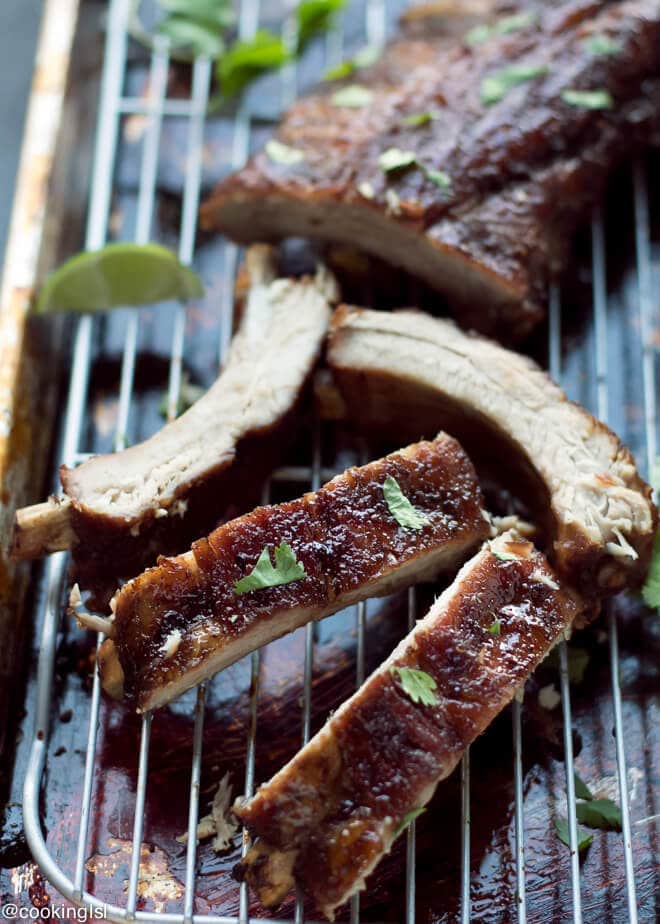 Soy Honey Glazed Pork Ribs Recipe. Smithfield All Natural baby back ribs, brushed with honey soy sauce, cut into pieces. on a wire rack over baking tray, garnished with lime and cilantro.Juicy, sticky, tender.