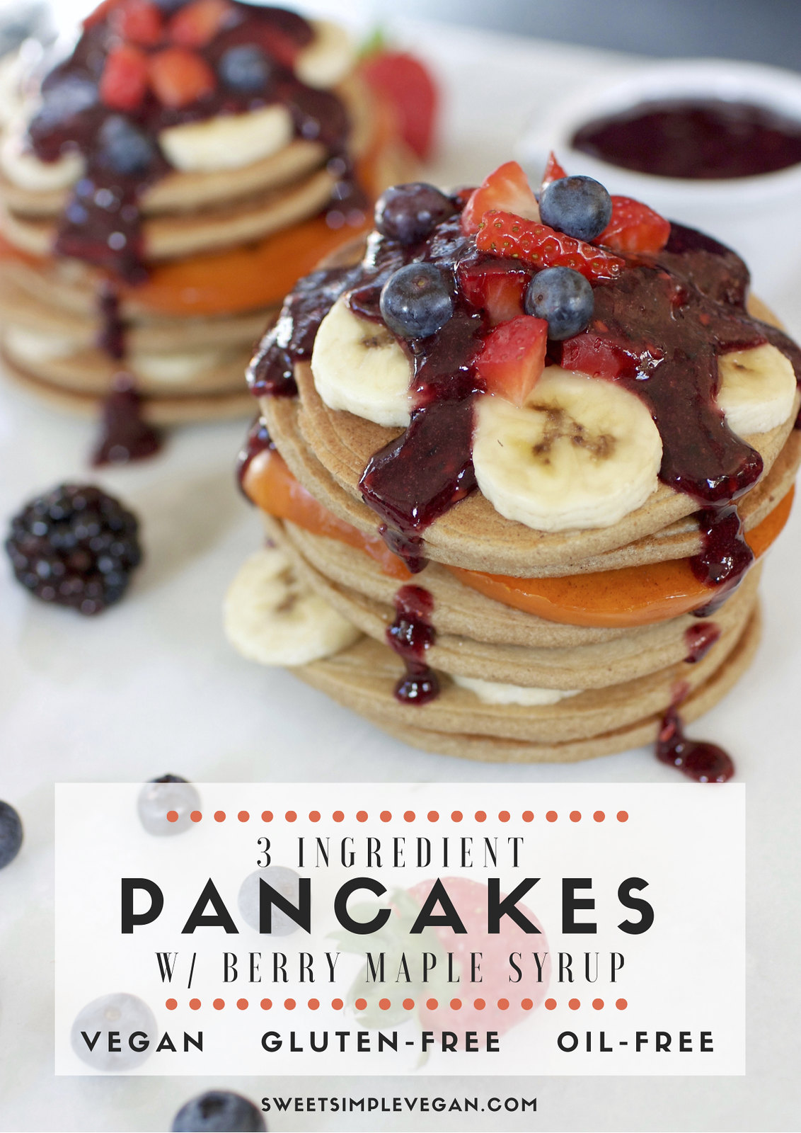 a 3/4 angle image of healthy 3-ingredient pancakes topped with fruit and berry maple syrup.