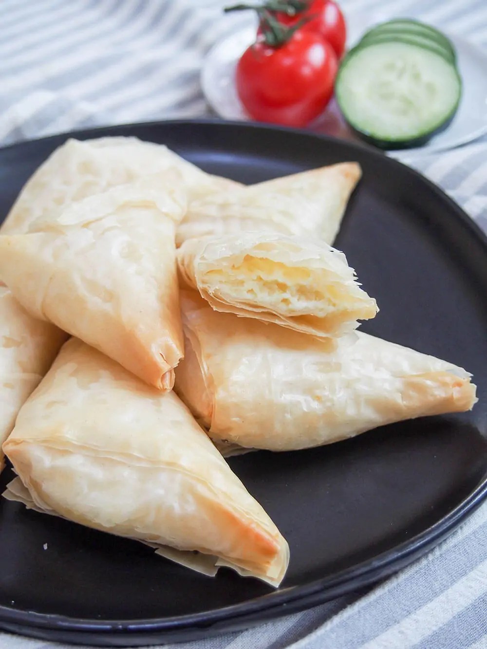 different stages of folding tiropita Greek cheese pastries