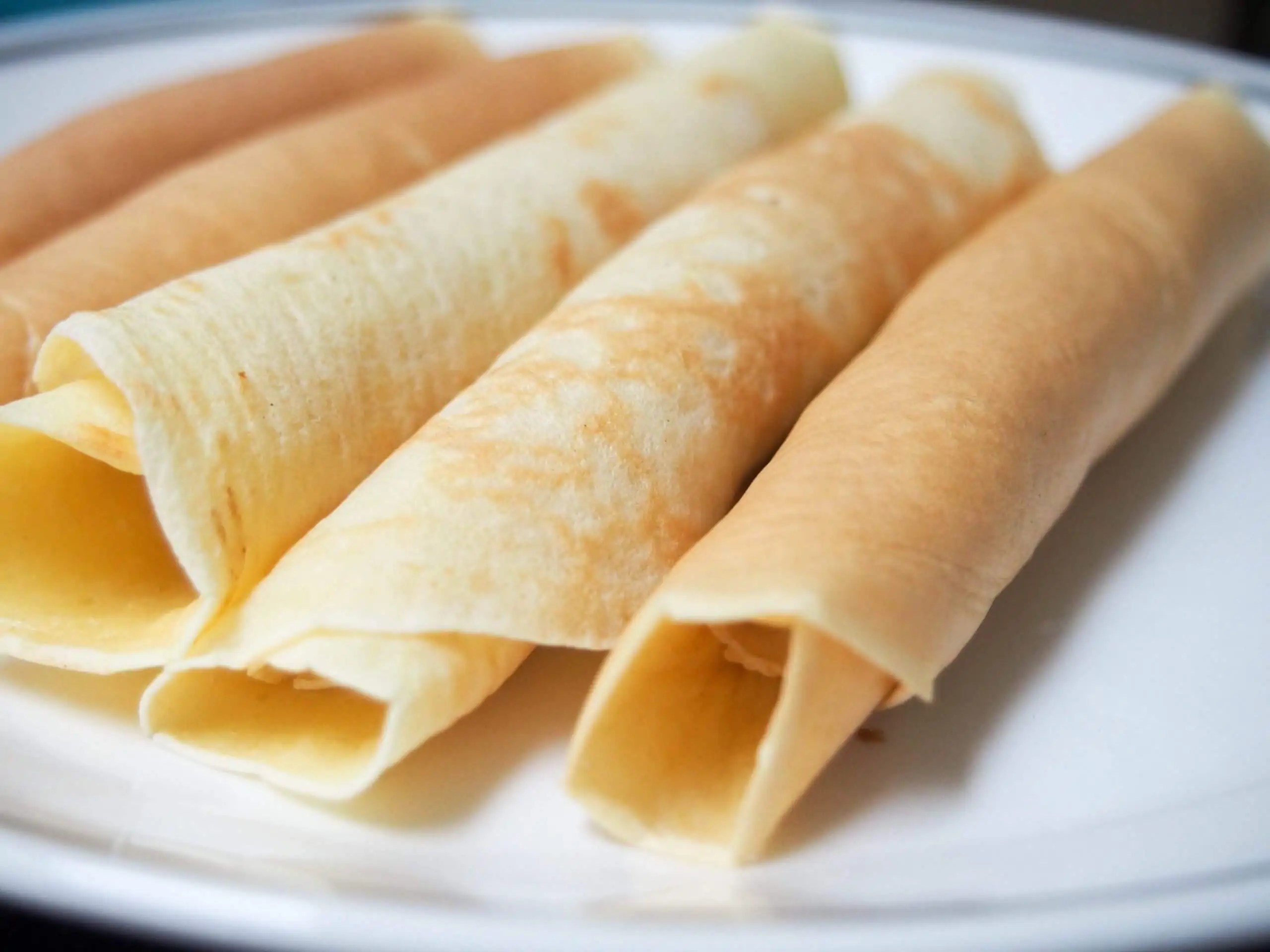 rolled up crepes on plate
