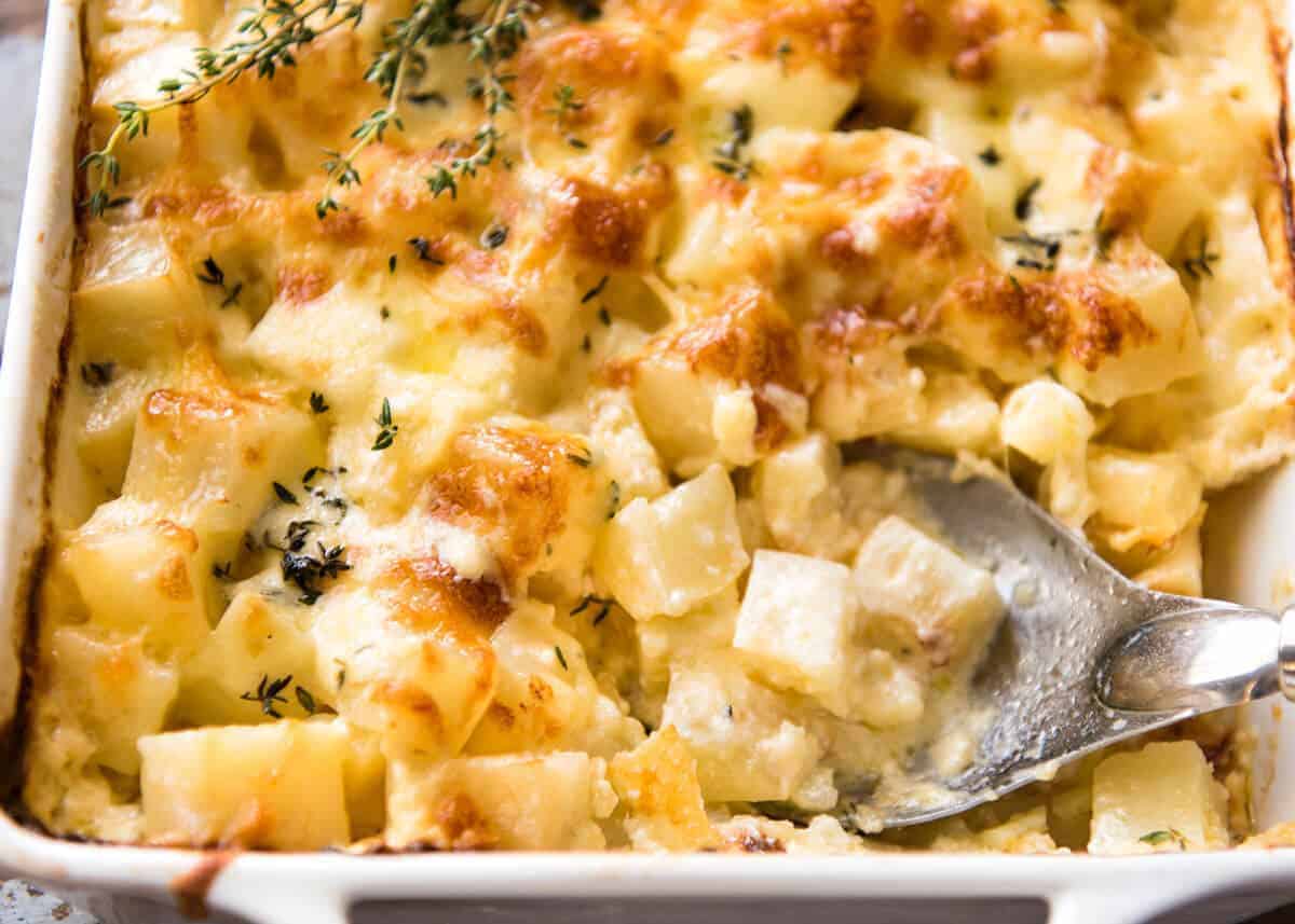 A faster, cheesier, creamier alternative to Scalloped Potatoes / Potato Gratin, this Easy Creamy Cheesy Potato Bake is made with cubed potatoes cooked in a cream and cheese sauce. www.recipetineats.com