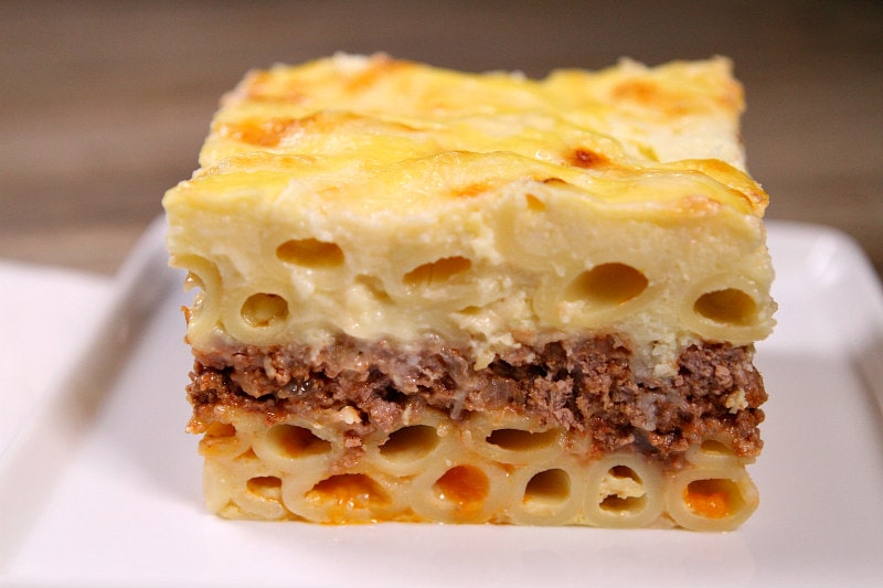 slice of pastitsio sitting on a white plate
